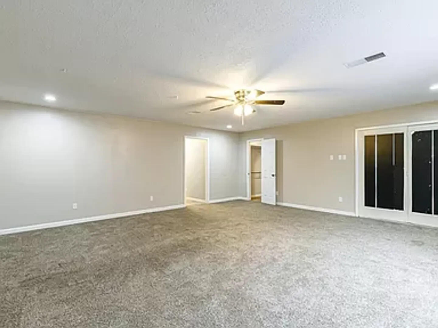 4634 Fordham Street Lubbock, TX 79416 - Photo 12 of 16 a view of an empty room with a chandelier fan