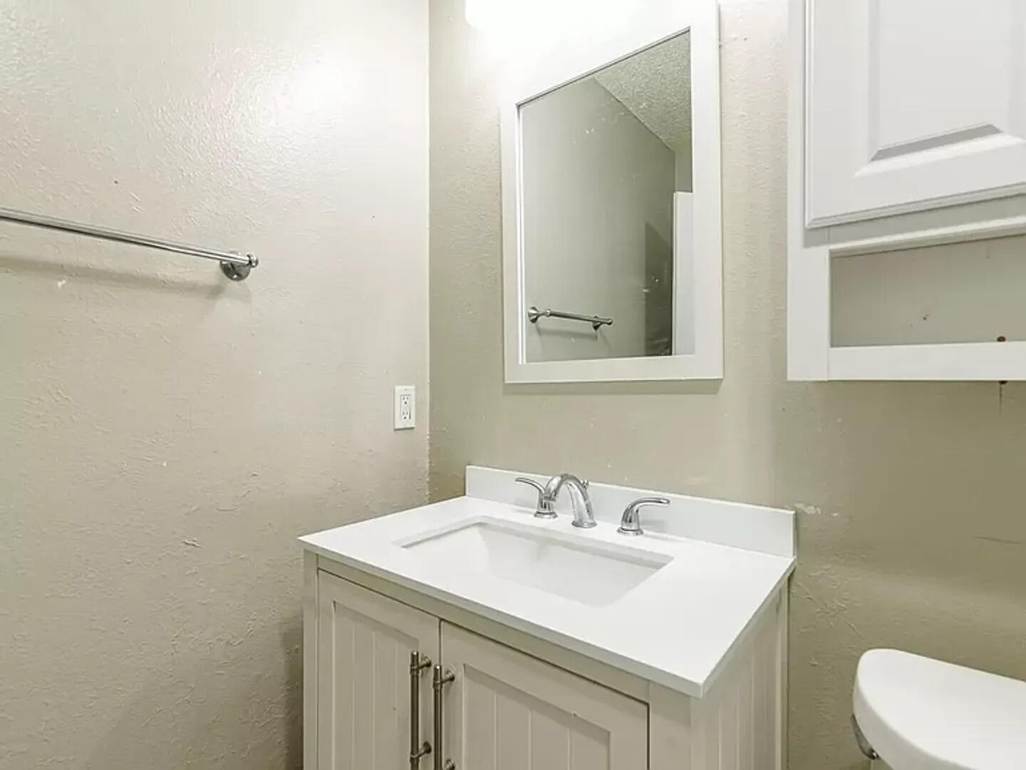 4634 Fordham Street Lubbock, TX 79416 - Photo 9 of 16 a bathroom with a sink toilet and mirror