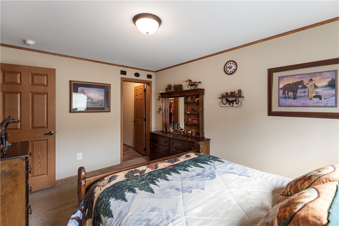 265 A State Rd S-37-141 Westminster, SC 29693 - Photo 28 of 33 A well-lit bedroom features warm-toned walls and wood trim.