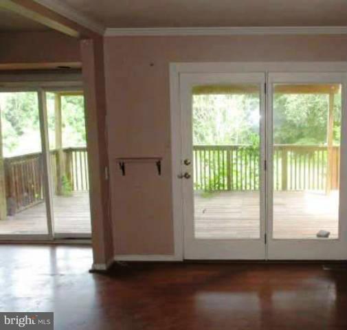 997 Ridge Road Finksburg, MD 21048 - Photo 4 of 7 a view of empty room with wooden floor and floor to ceiling window