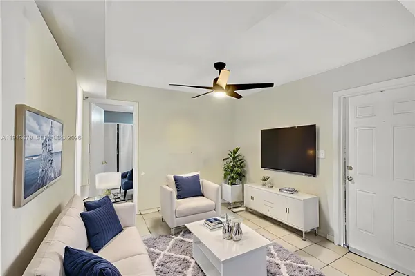 a living room with furniture and a window