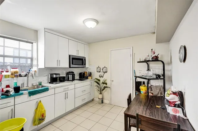 a bedroom with a bed and a mirror