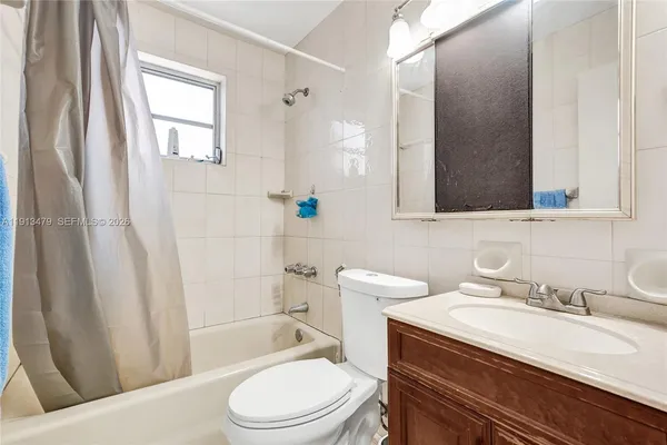 a front view of a house with swimming pool and furniture