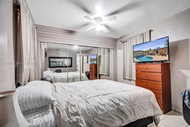 a front view of a house with swimming pool and furniture