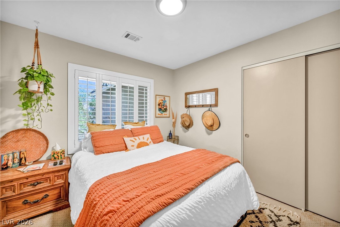 1234 Sunfire Street Henderson, NV 89014 - Photo 18 of 40 A naturally illuminated bedroom offers a tranquil retreat, complete with functional closet space and inviting window features.