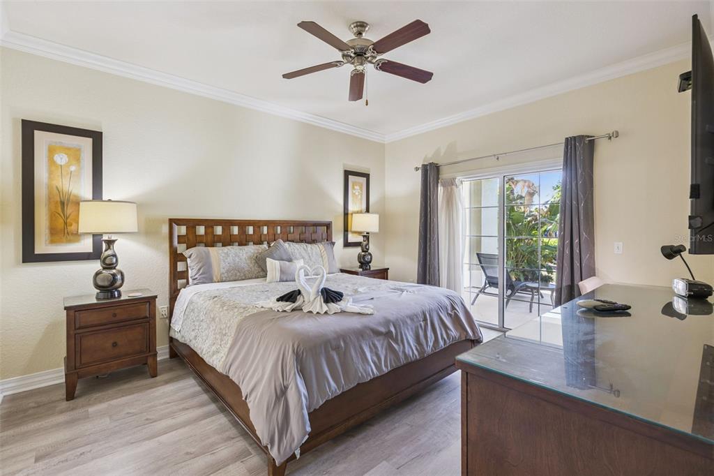7602 Sandy Ridge Drive, Unit 103 Reunion, FL 34747 - Photo 14 of 61 a bedroom with bed and window