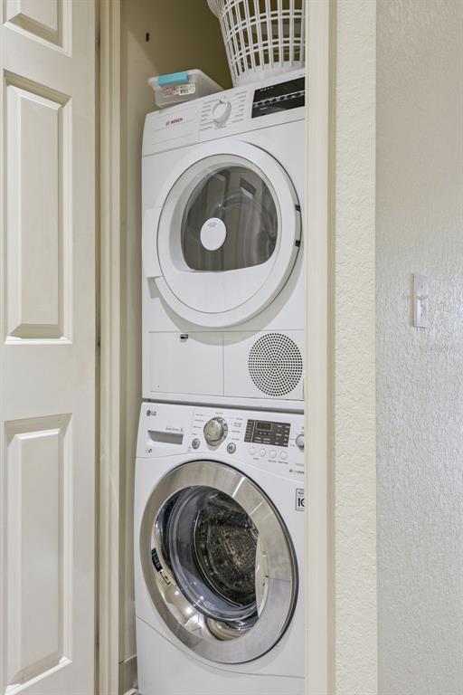 7602 Sandy Ridge Drive, Unit 103 Reunion, FL 34747 - Photo 22 of 61 a utility room with dryer and washer