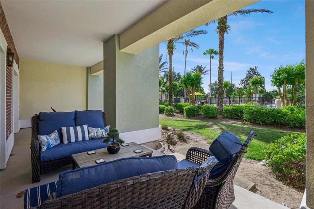 7602 Sandy Ridge Drive, Unit 103 Reunion, FL 34747 - Photo 35 of 61 a view of an outdoor sitting area with furniture and garden