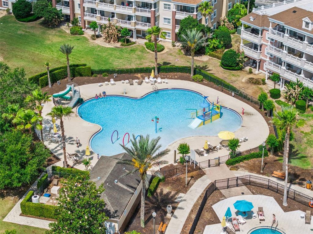 7602 Sandy Ridge Drive, Unit 103 Reunion, FL 34747 - Photo 39 of 61 an aerial view of a house with a swimming pool patio and outdoor seating