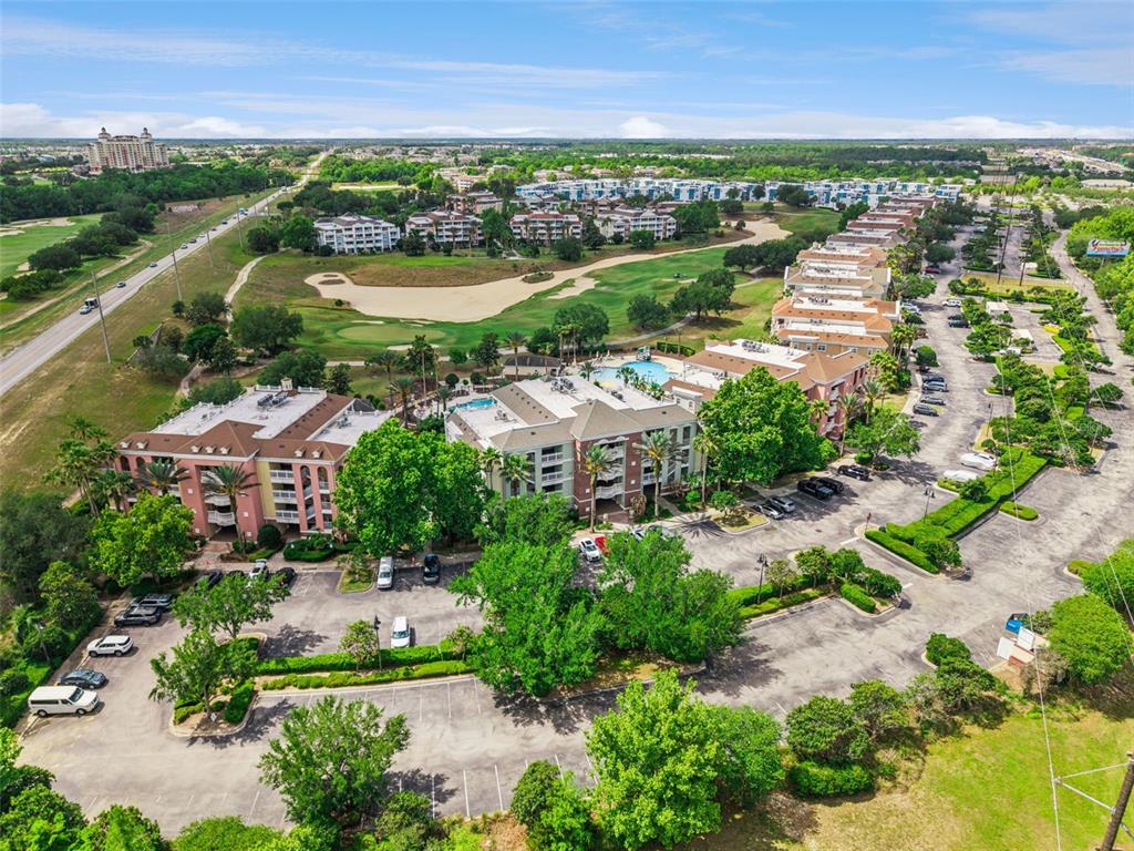 7602 Sandy Ridge Drive, Unit 103 Reunion, FL 34747 - Photo 41 of 61 an aerial view of residential building and lake view