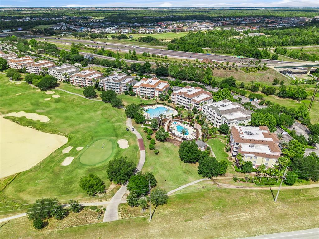 7602 Sandy Ridge Drive, Unit 103 Reunion, FL 34747 - Photo 42 of 61 an aerial view of residential houses with outdoor space