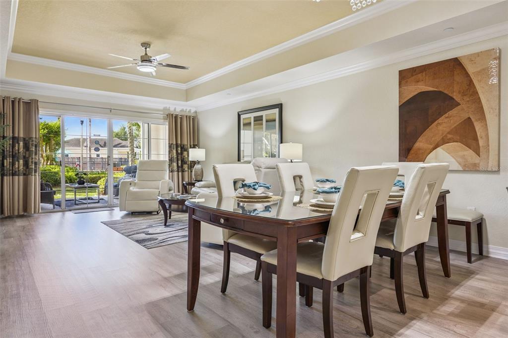 7602 Sandy Ridge Drive, Unit 103 Reunion, FL 34747 - Photo 5 of 61 a view of a dining room with furniture window and outside view
