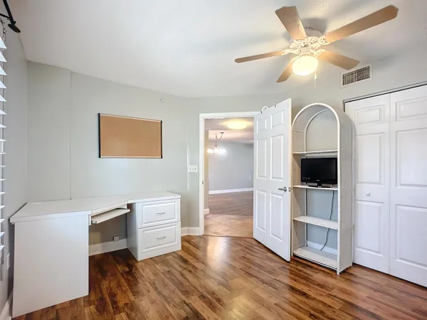 a bathroom with a toilet a sink and a mirror
