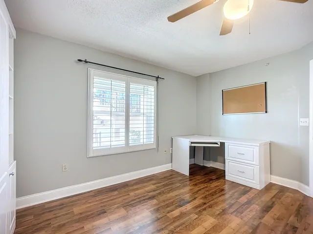 a bathroom with a granite countertop toilet a sink and bathtub