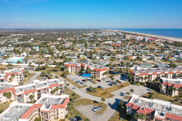 a view of water with palm trees
