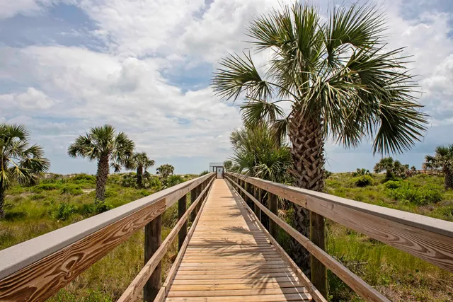 a view of ocean with a large bridge