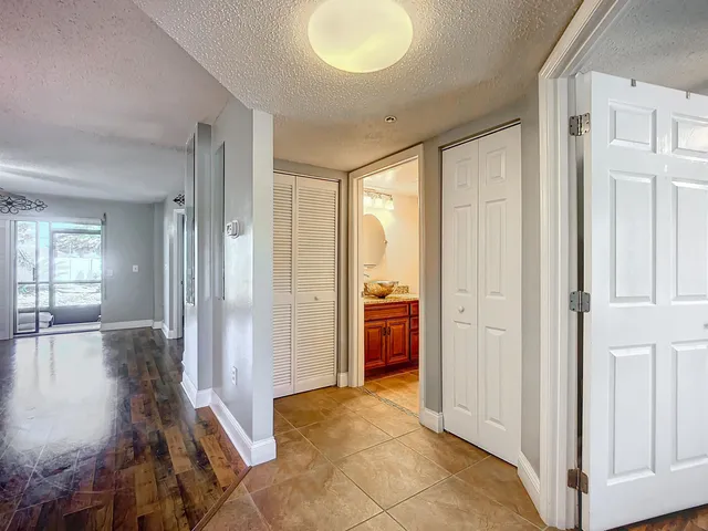 a kitchen with stainless steel appliances granite countertop a stove sink and refrigerator