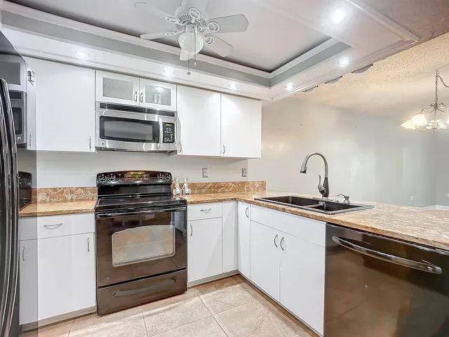 a kitchen with a stove microwave and refrigerator