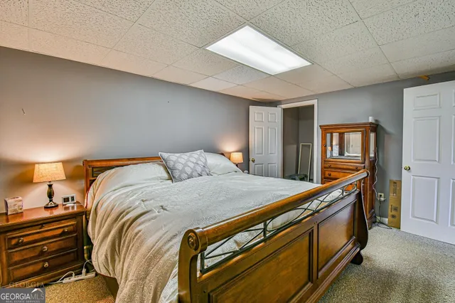 a bed room with a bed and a dresser