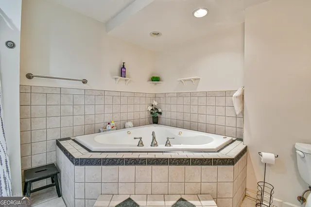a bathroom with a tub and sink