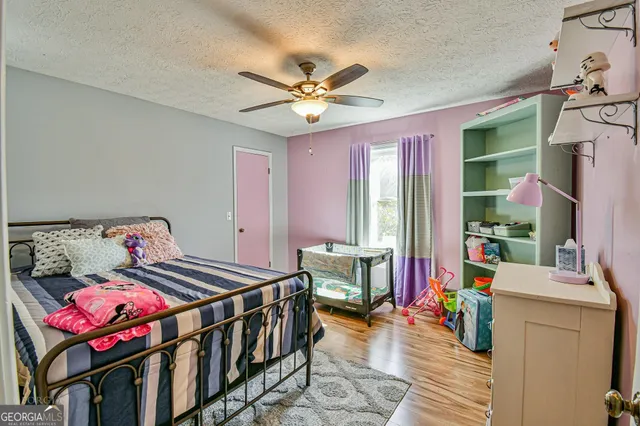 a bedroom with furniture and a chandelier