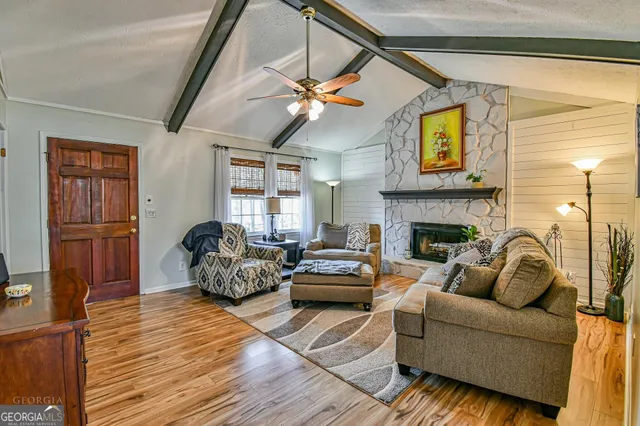 a living room with furniture and a fireplace