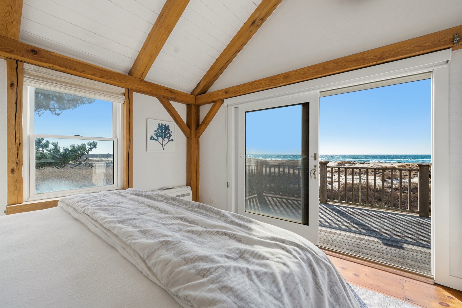 45 Sheep Pond Road Nantucket, MA 02554 - Photo 18 of 39 a bedroom with a bed and a large window