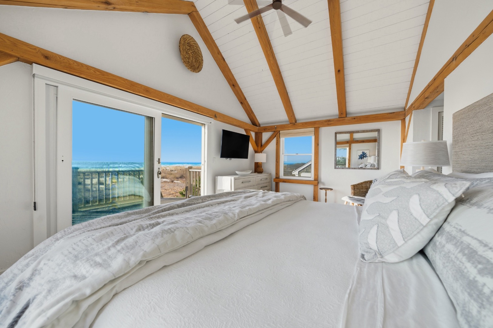 45 Sheep Pond Road Nantucket, MA 02554 - Photo 19 of 39 a large bed sitting in a bedroom next to a window