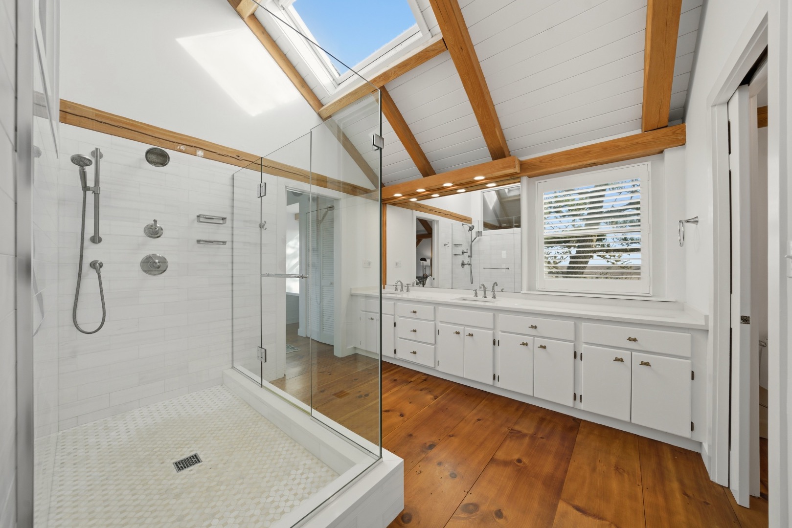 45 Sheep Pond Road Nantucket, MA 02554 - Photo 23 of 39 a bathroom with a tub sink and shower