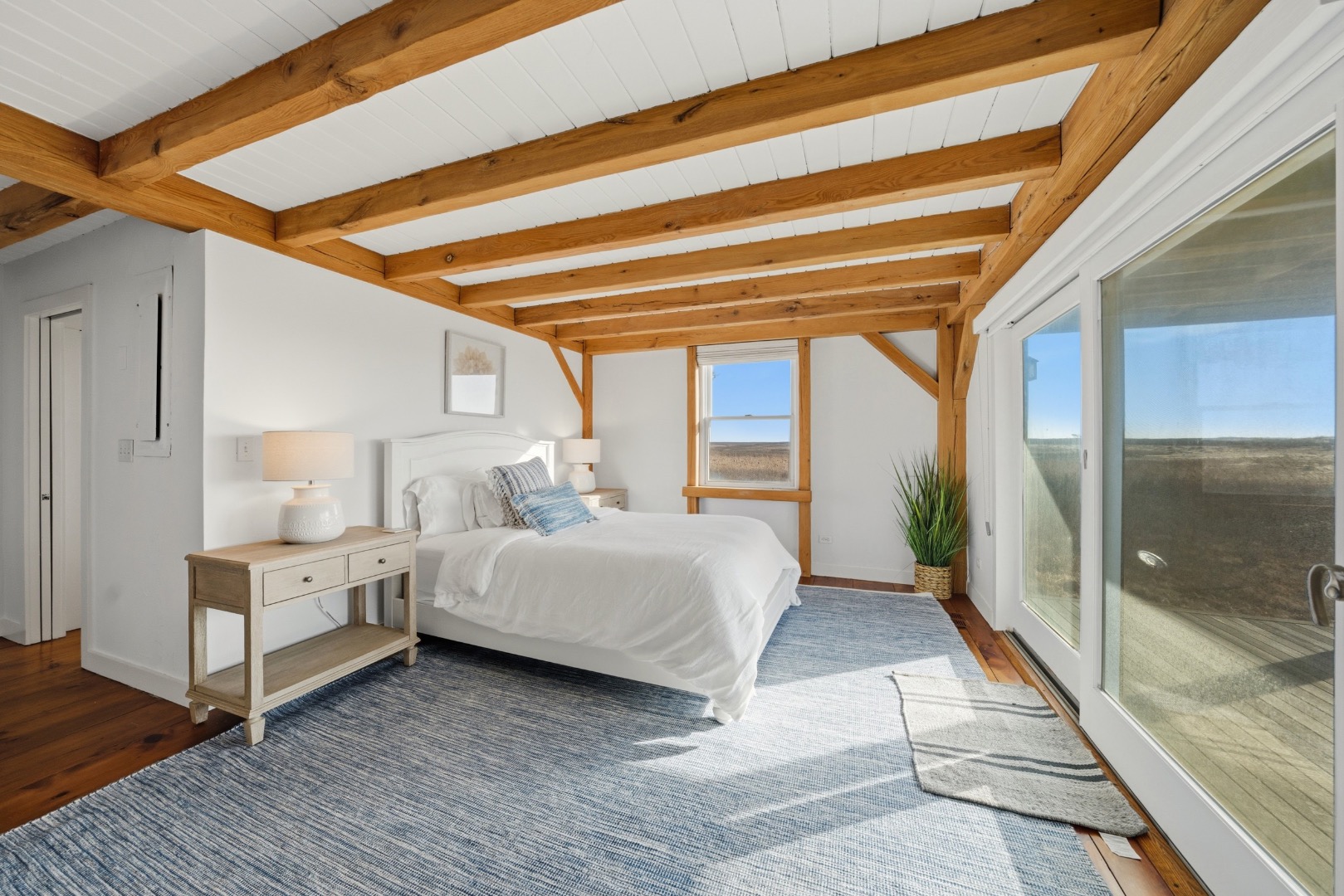 45 Sheep Pond Road Nantucket, MA 02554 - Photo 32 of 39 a bed room with a bed and a large window