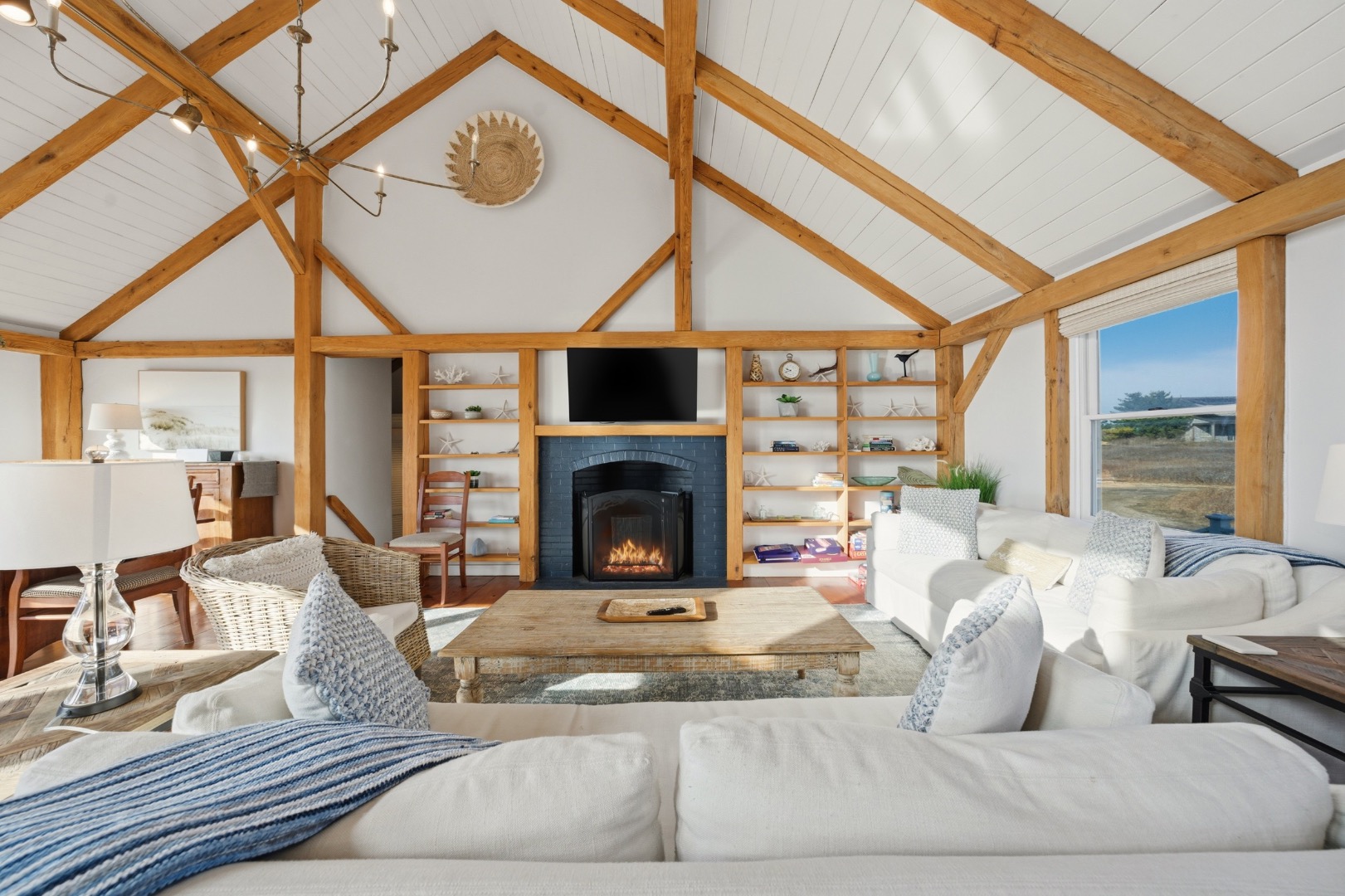 45 Sheep Pond Road Nantucket, MA 02554 - Photo 6 of 39 a living room with furniture a fireplace and a table