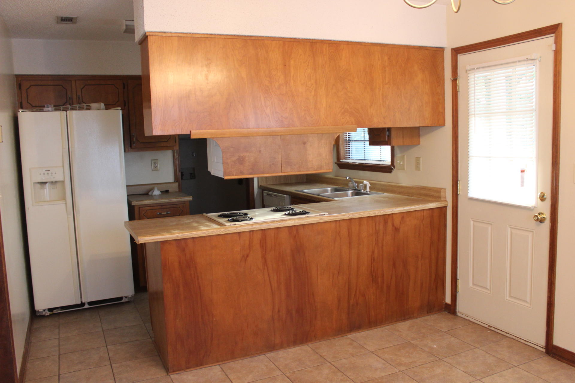 315 John King Road Crestview, FL 32539 - Photo 2 of 12 a room with stainless steel appliances granite countertop a refrigerator and a stove