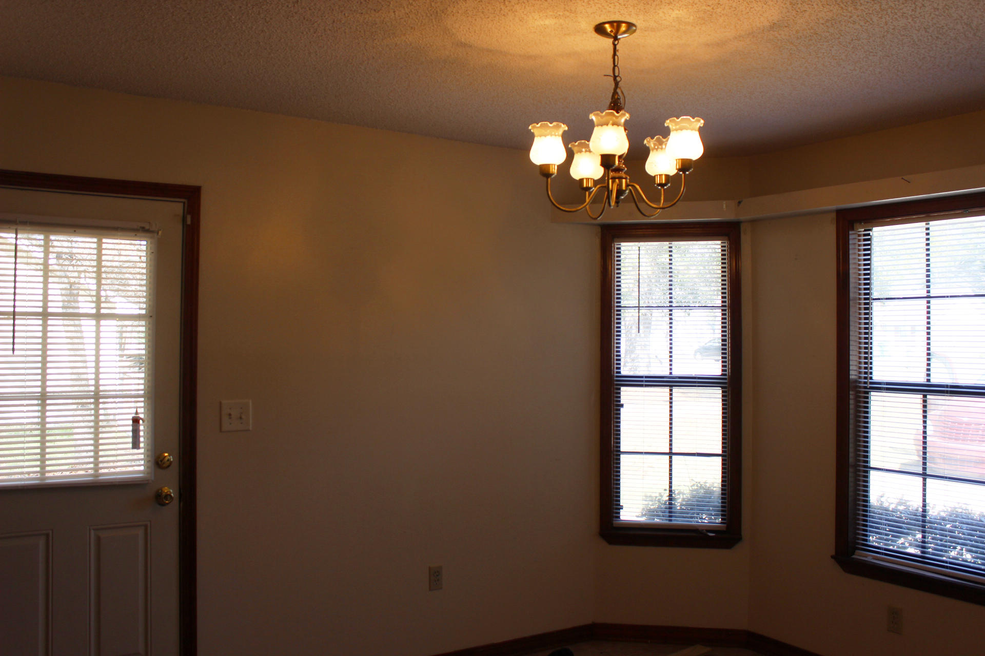 315 John King Road Crestview, FL 32539 - Photo 6 of 12 a dining room with chandelier window and chandelier