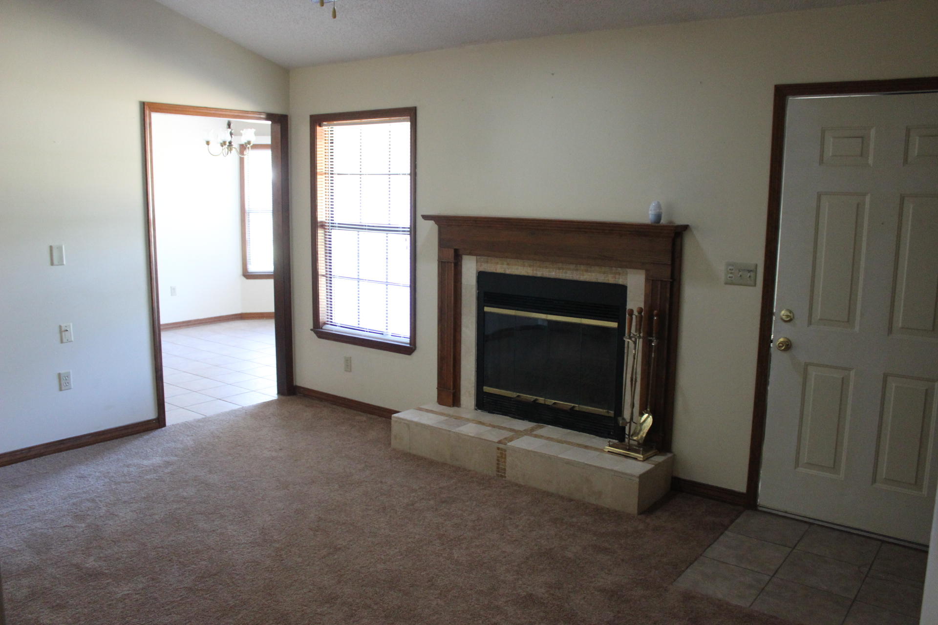 315 John King Road Crestview, FL 32539 - Photo 9 of 12 an empty room with a fireplace