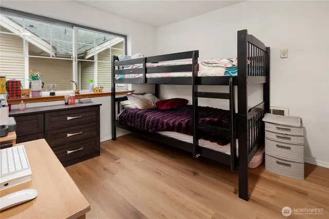 a bedroom with a bed and a dresser