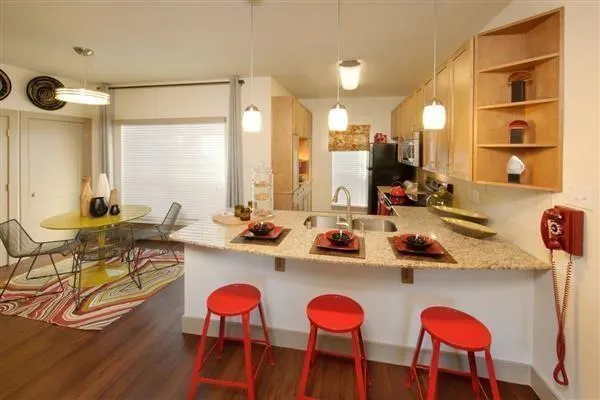 a very nice looking dining room with furniture