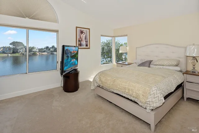 a spacious bathroom with a granite countertop sink mirror and shower