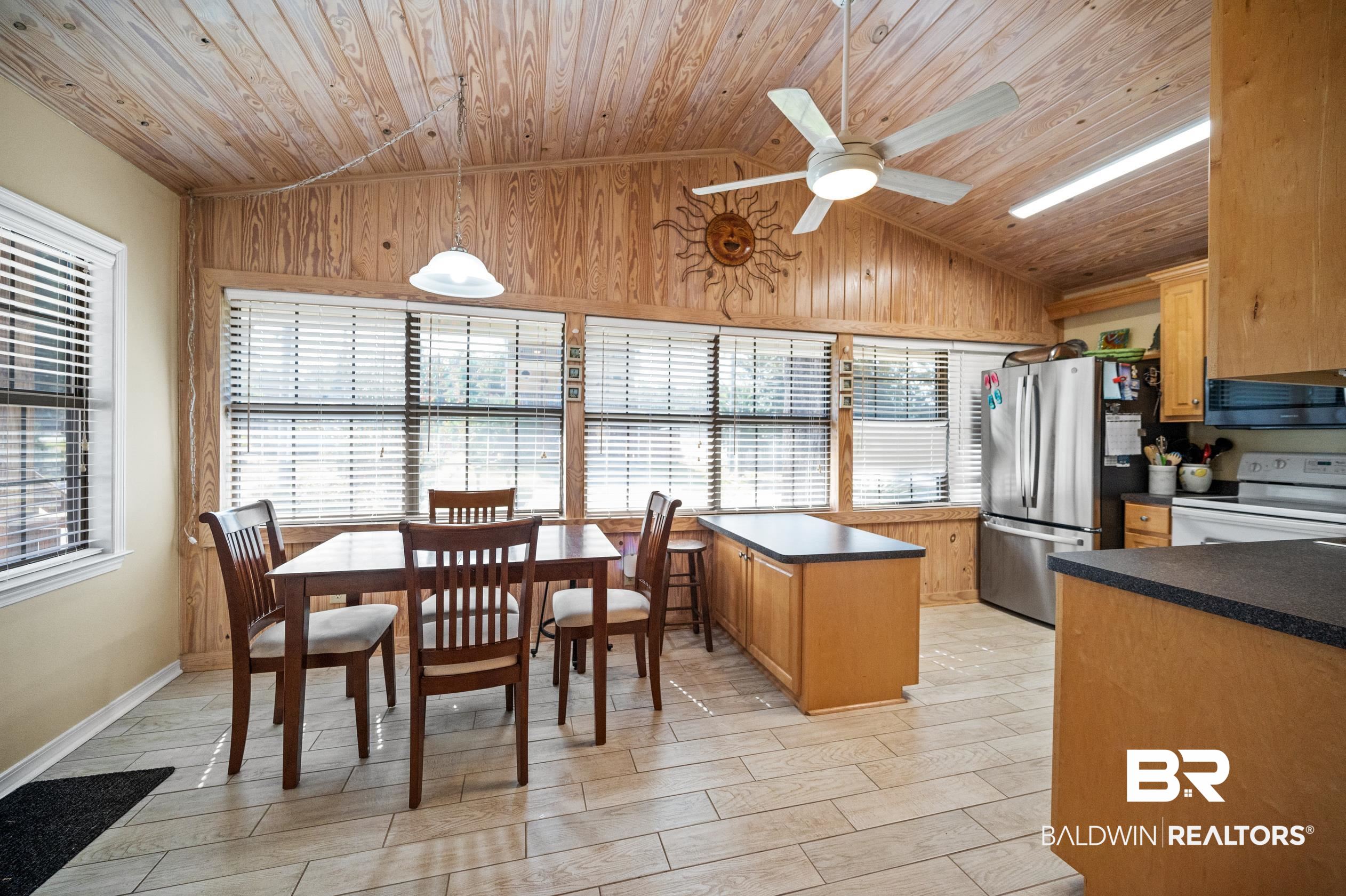 5392 Ornacor Avenue Orange Beach, AL 36561 - Photo 8 of 48 Kitchen with appliances with stainless steel finishes, lofted ceiling, a kitchen island, ceiling fan, and wooden ceiling