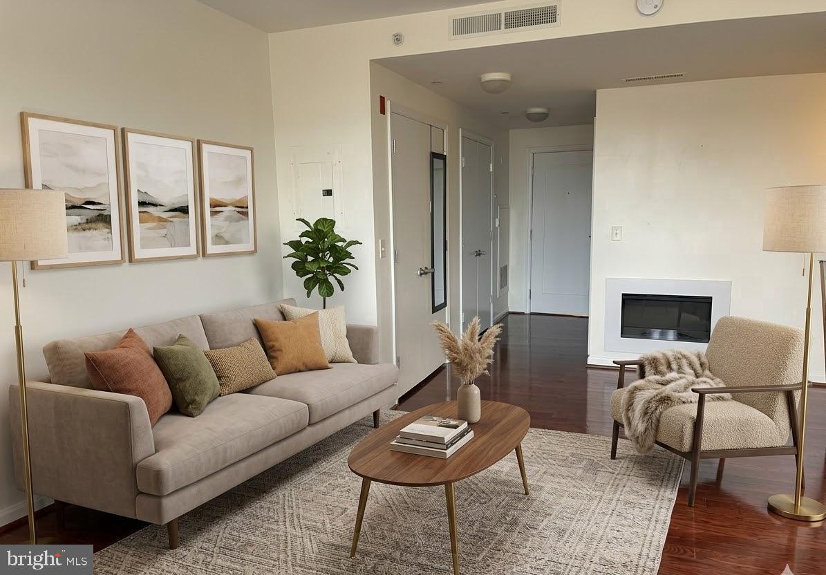 355 I Street Southwest, Unit 626 Washington, DC 20024 - Photo 13 of 37 a living room with furniture and a potted plant