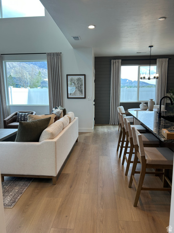 2011 West 1150 South, Unit 1042 Payson, UT 84651 - Photo 11 of 39 Photos are of model home.Open-concept living area featuring wood-finish flooring throughout