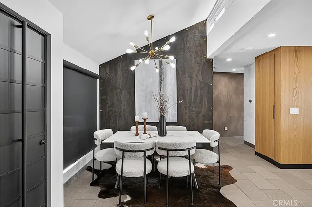 a kitchen with a stove and a white cabinet