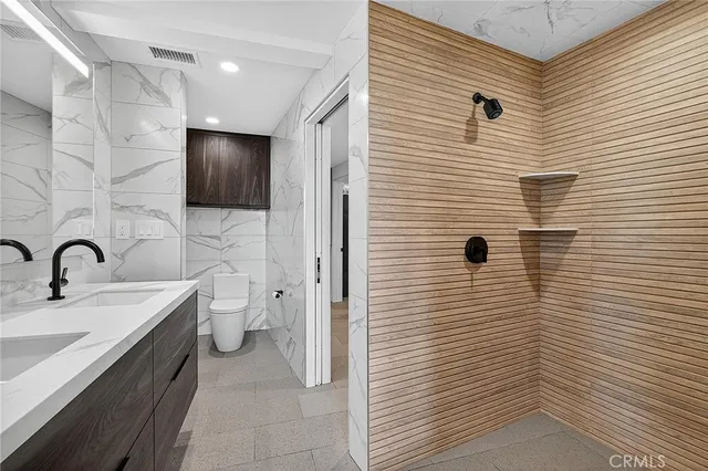 an aerial view of a house with garden space and street view