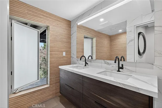 an aerial view of residential houses with city view