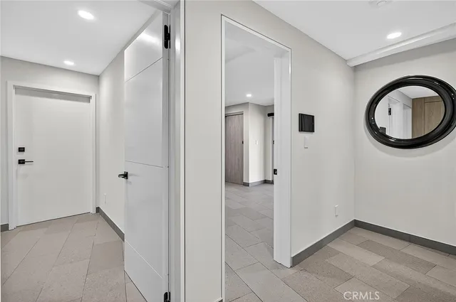 an aerial view of a house with a yard and trees