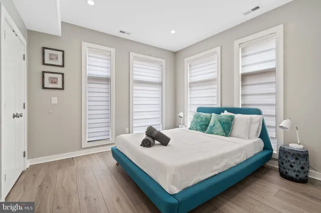 a bedroom with a bed and window