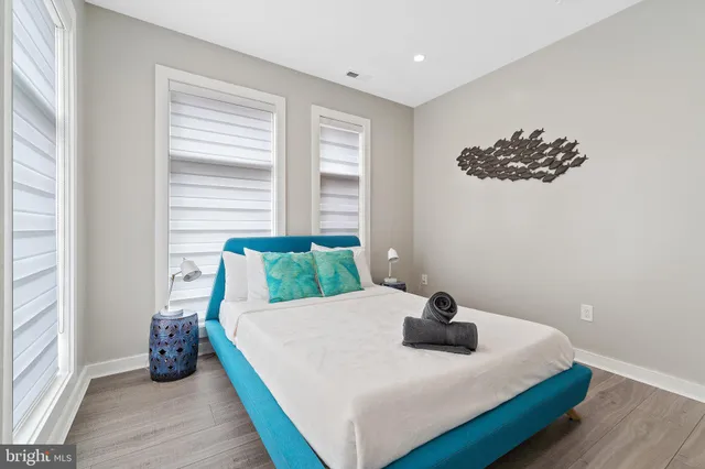 a bathroom with a tub and small window