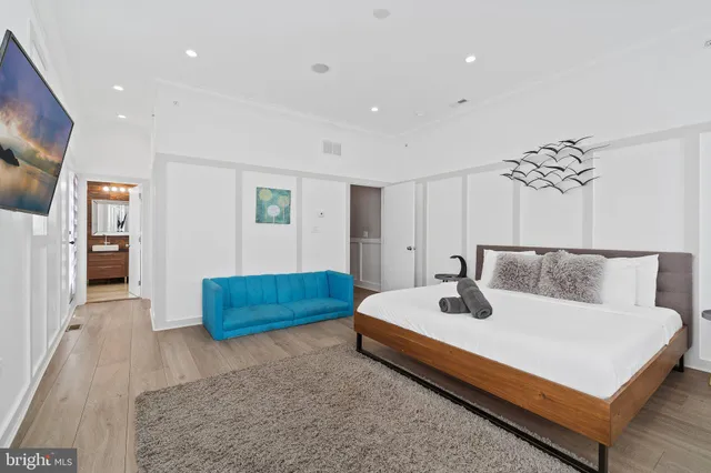 a view of hall way with mirror and window