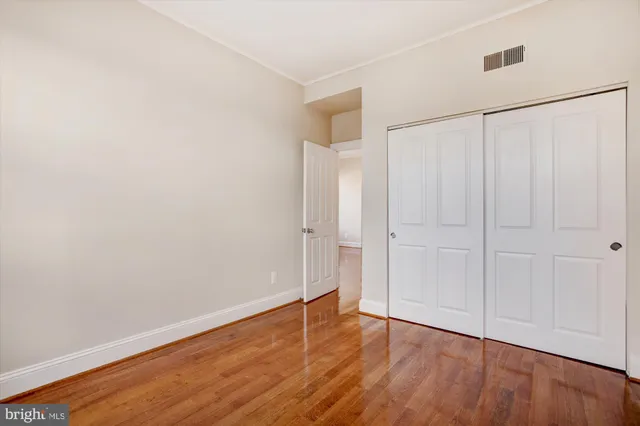 a balcony with table and chairs