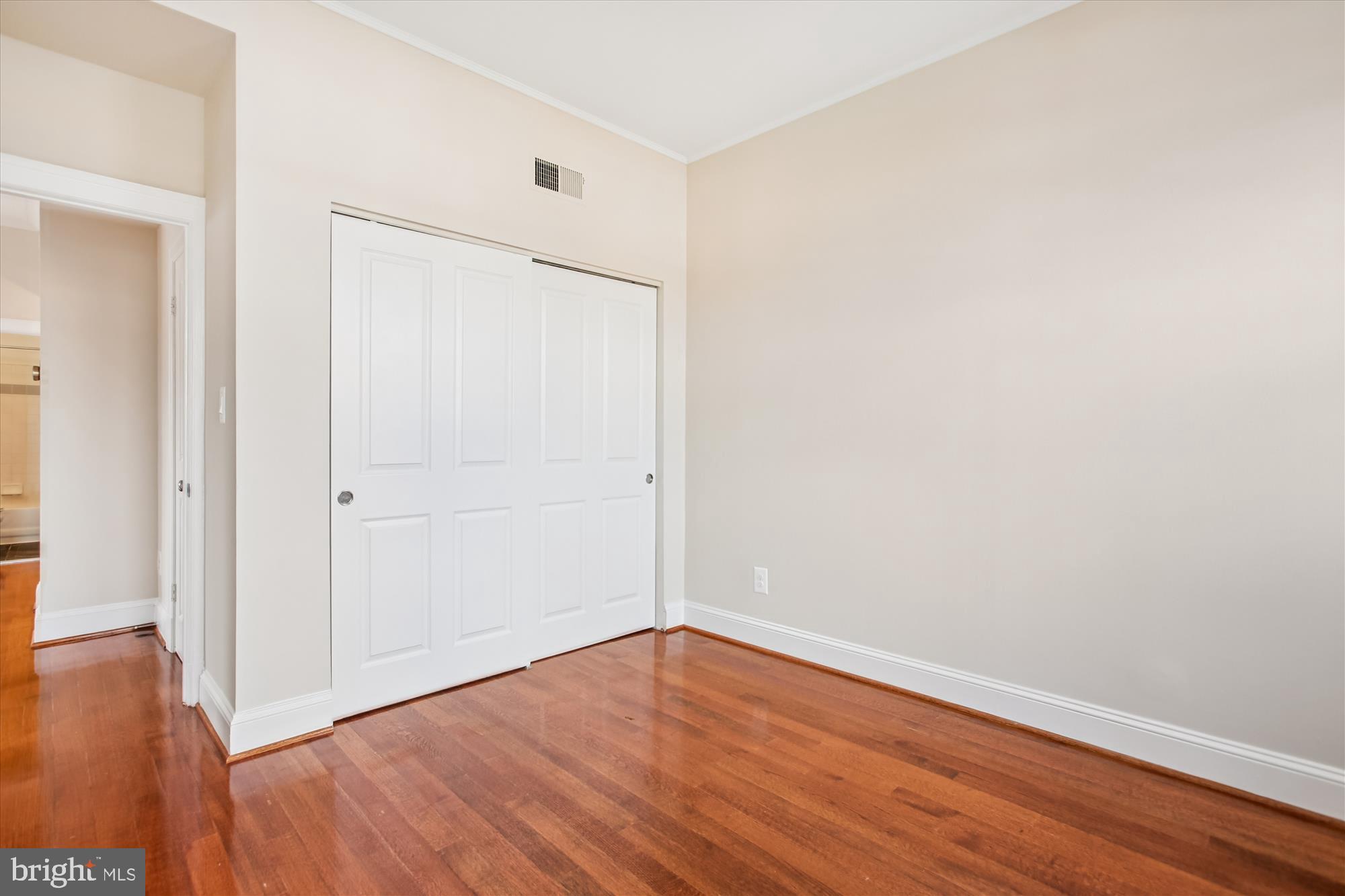 2008 16th Street Northwest, Unit 402 Washington, DC 20009 - Photo 18 of 34 a view of an empty room with wooden floor