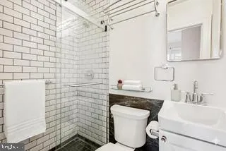 a close view of sink and black and white wooden floor
